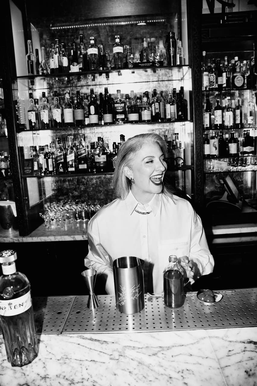 Giulia Cuccurullo standing behind a bar with a mixer in her hand